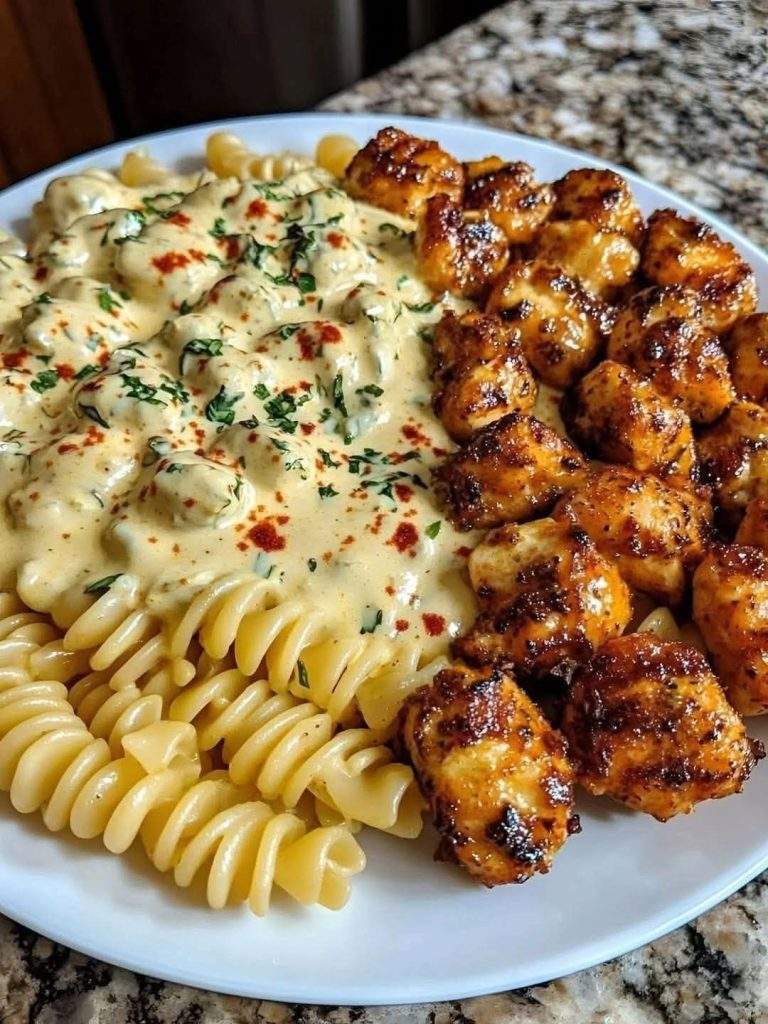 Cajun Chicken Pasta loaded with garlic butter chicken bites and creamy Alfredo sauce – a rich, spicy, and irresistible twist on your favorite pasta night!